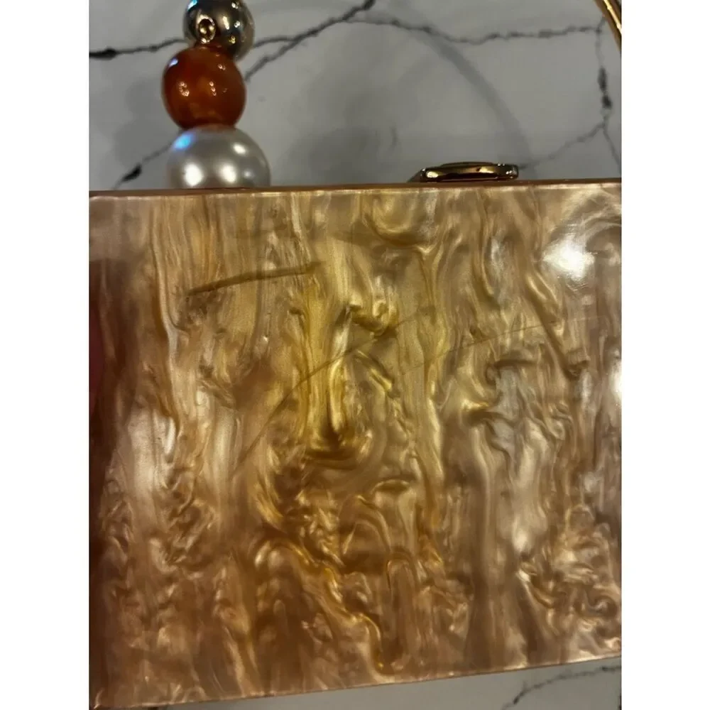 Lulu's Pearlescent Pink Acrylic Box Clutch with Gold Ring Handle
